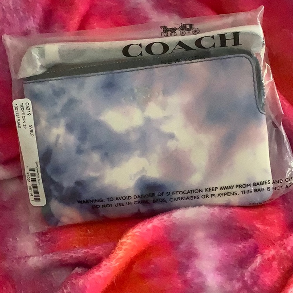 New in package coach, tie-dye, corner zip wristlet, purple